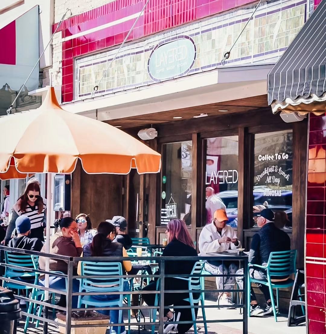 Guests on the Layered patio on the McKinney square